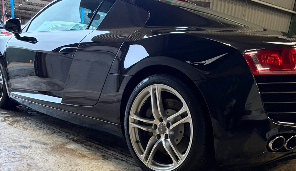 Side on view of a black Audi R8